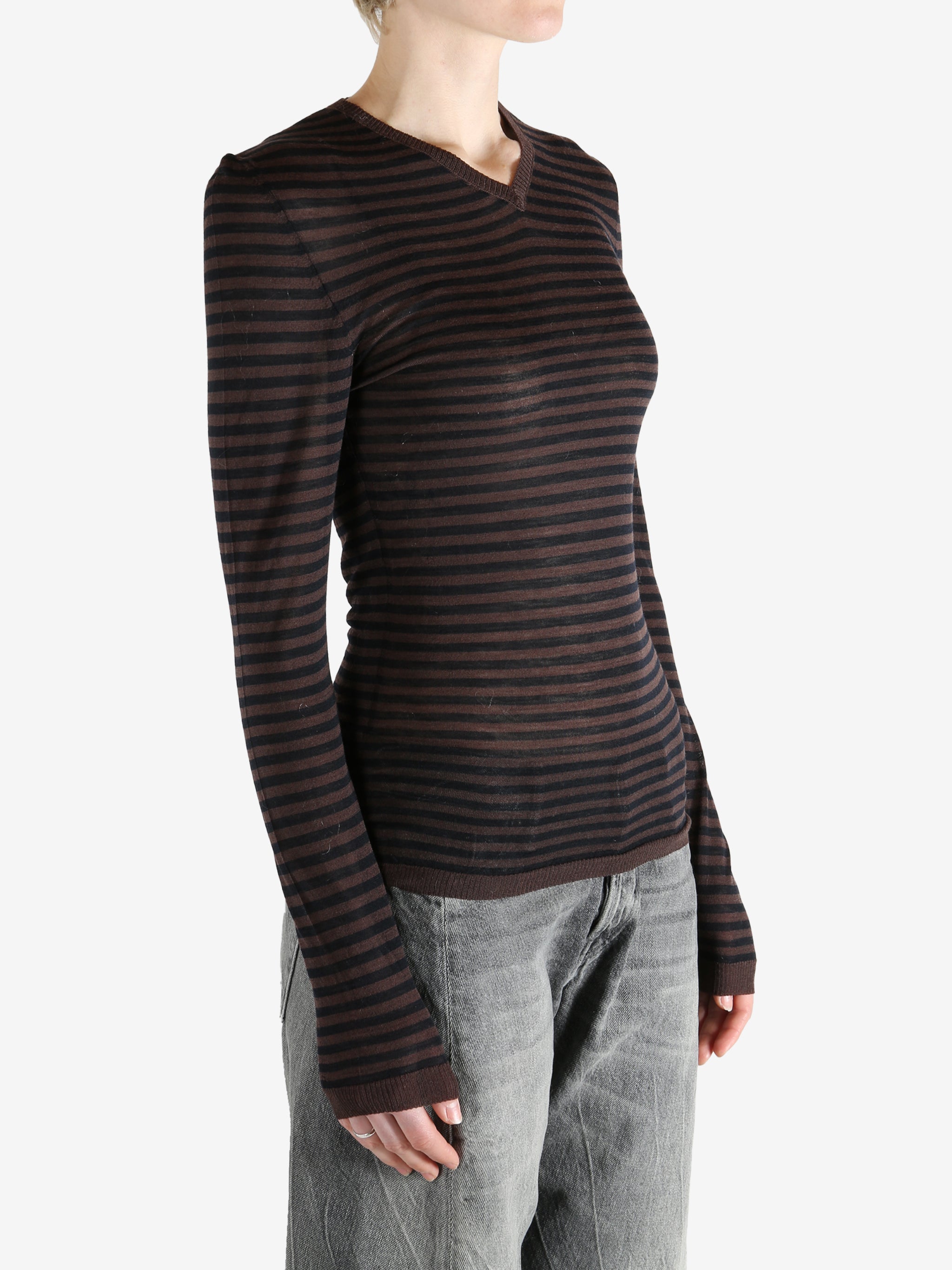 Brown top worn by a person, showing the top's fit