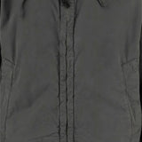 Close up of grey jackets, showing texture of the cotton fabric