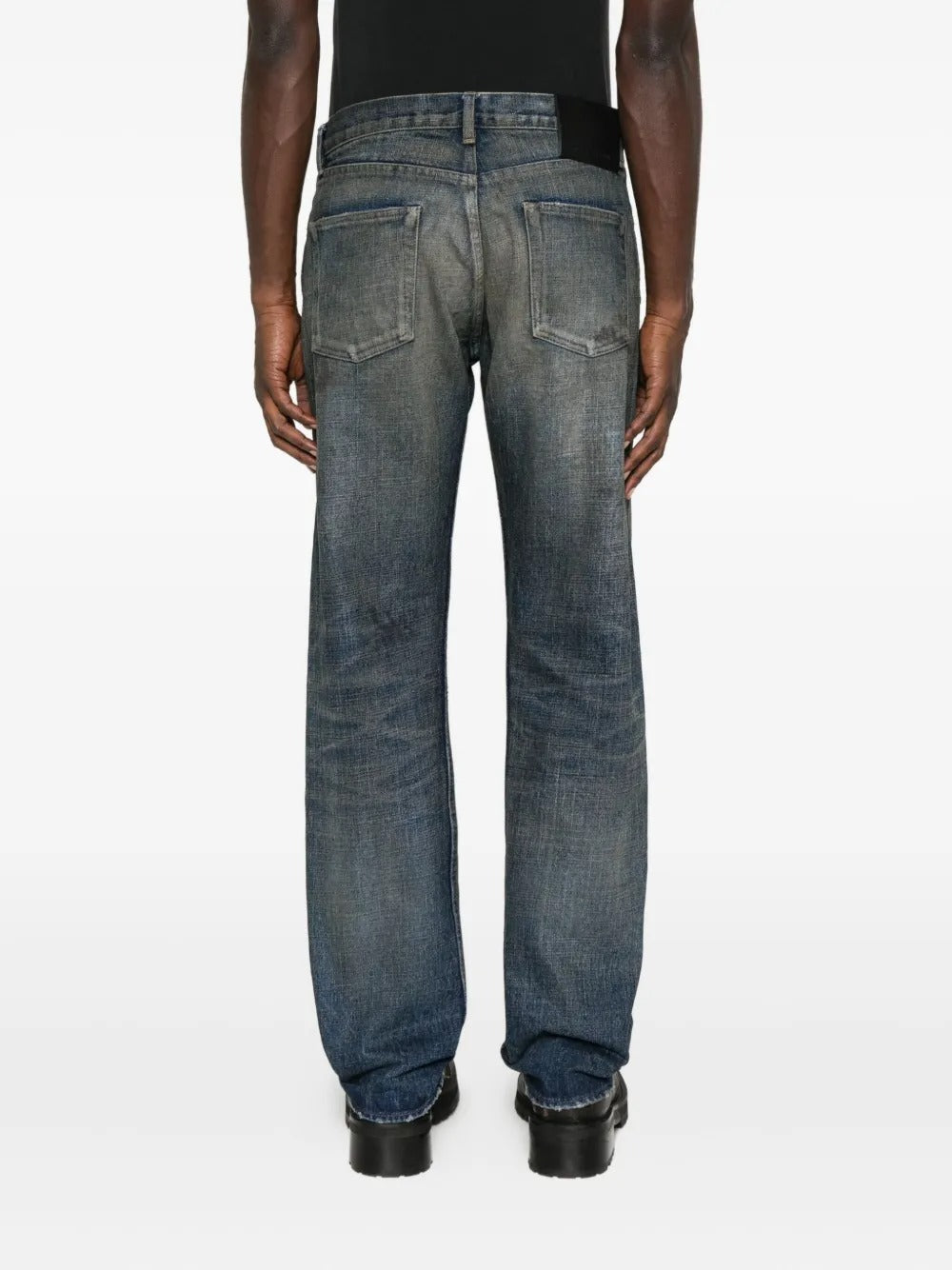 Blue jeans worn by a person, showing the jeans' fit