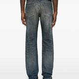 Blue jeans worn by a person, showing the jeans' fit