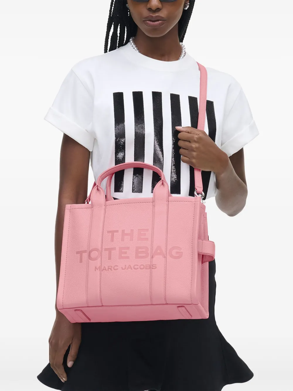 pink bags worn by a person, showing the bags fit