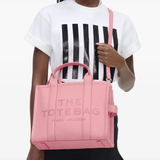pink bags worn by a person, showing the bags fit