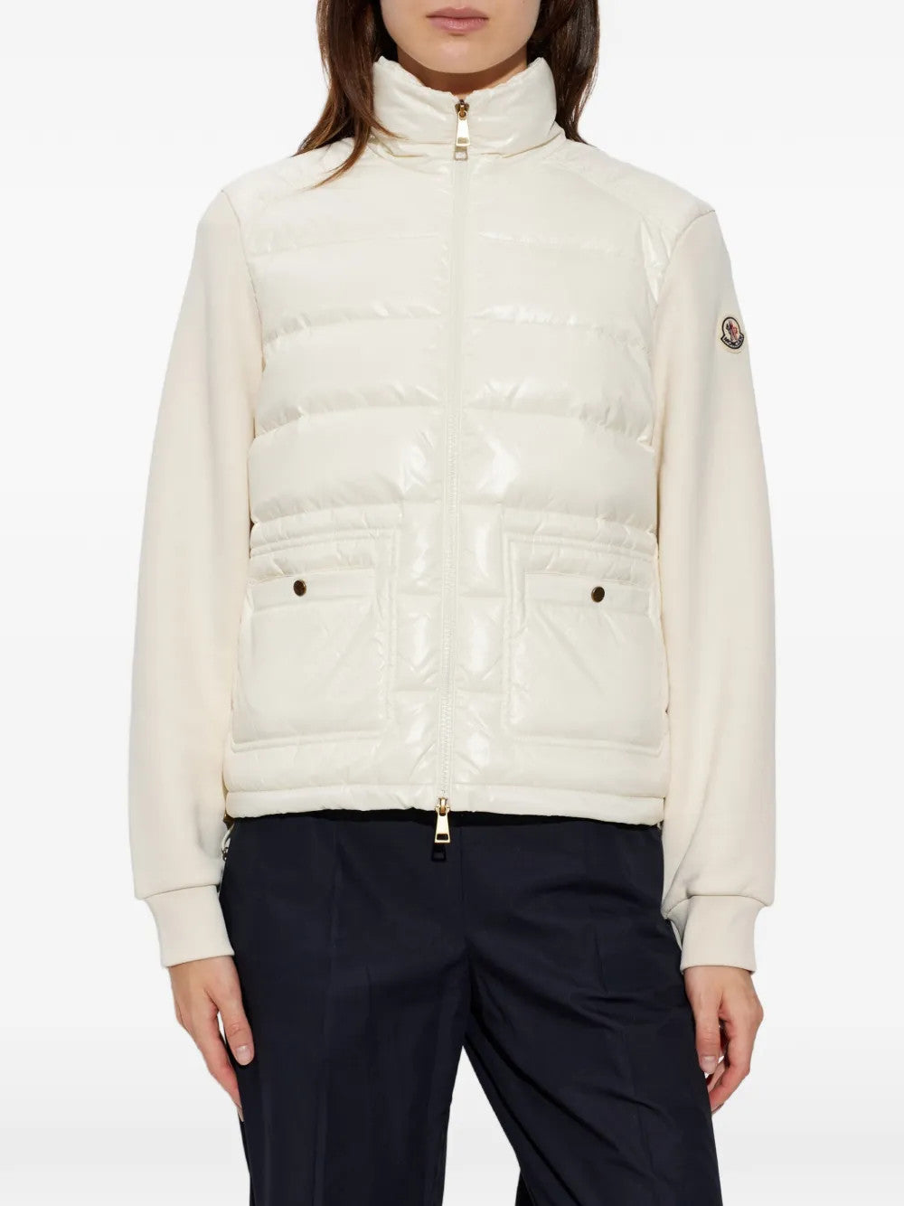 White knitwear worn by a person, showing the knitwear fit