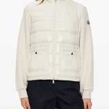 White knitwear worn by a person, showing the knitwear fit
