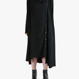 Black dress worn by a person, showing the dress' fit