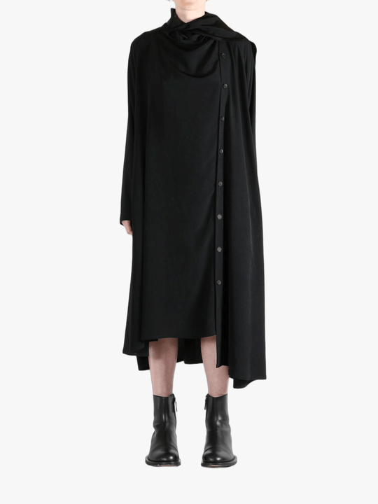 Black dress worn by a person, showing the dress' fit