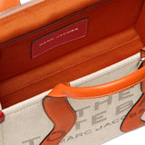 Close up of the tan bag, showing texture of the cotton fabric