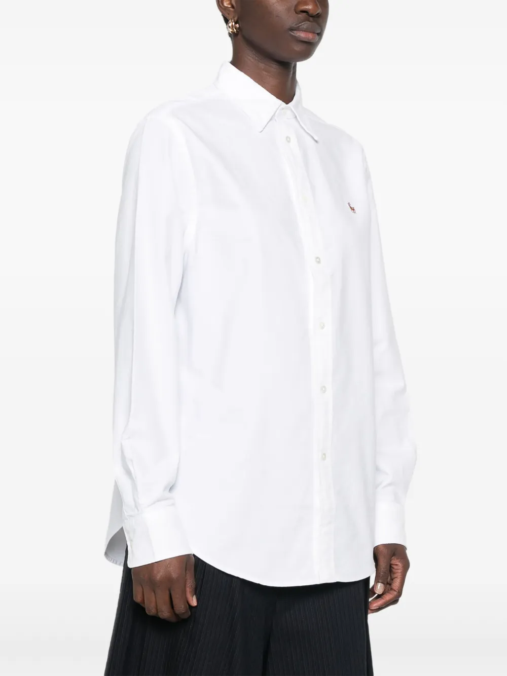 White shirt,worn by a person, showing the shirt's fit