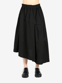 Black skirt worn by a person, showing the skirt's fit