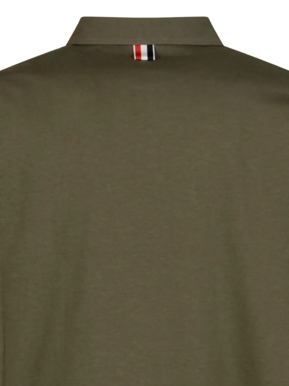 Close up of green t-shirt, showing texture of the Cotton fabric