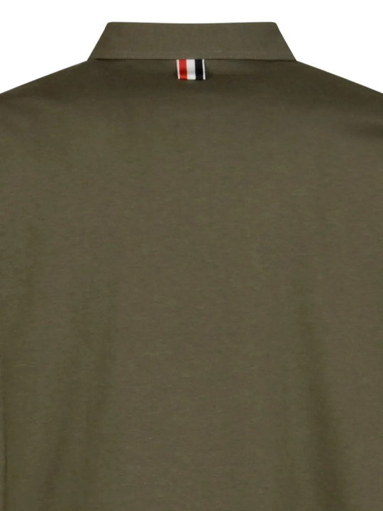 Close up of green t-shirt, showing texture of the Cotton fabric