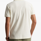 Tan shirt worn by a person, showing the shirt fit