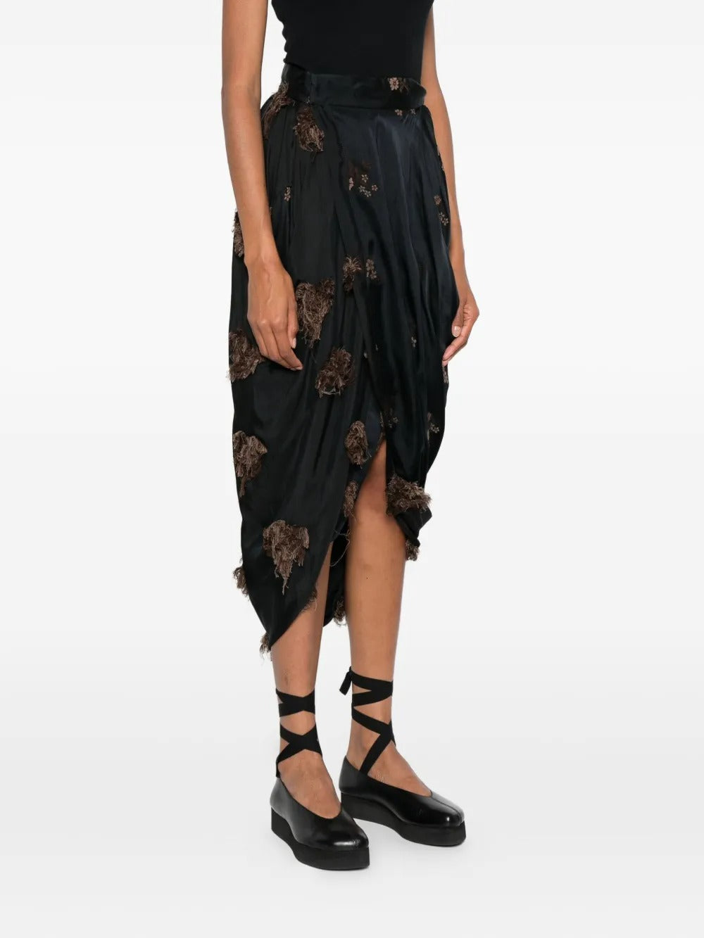 Black skirt worn by a person, showing the skirt's fit