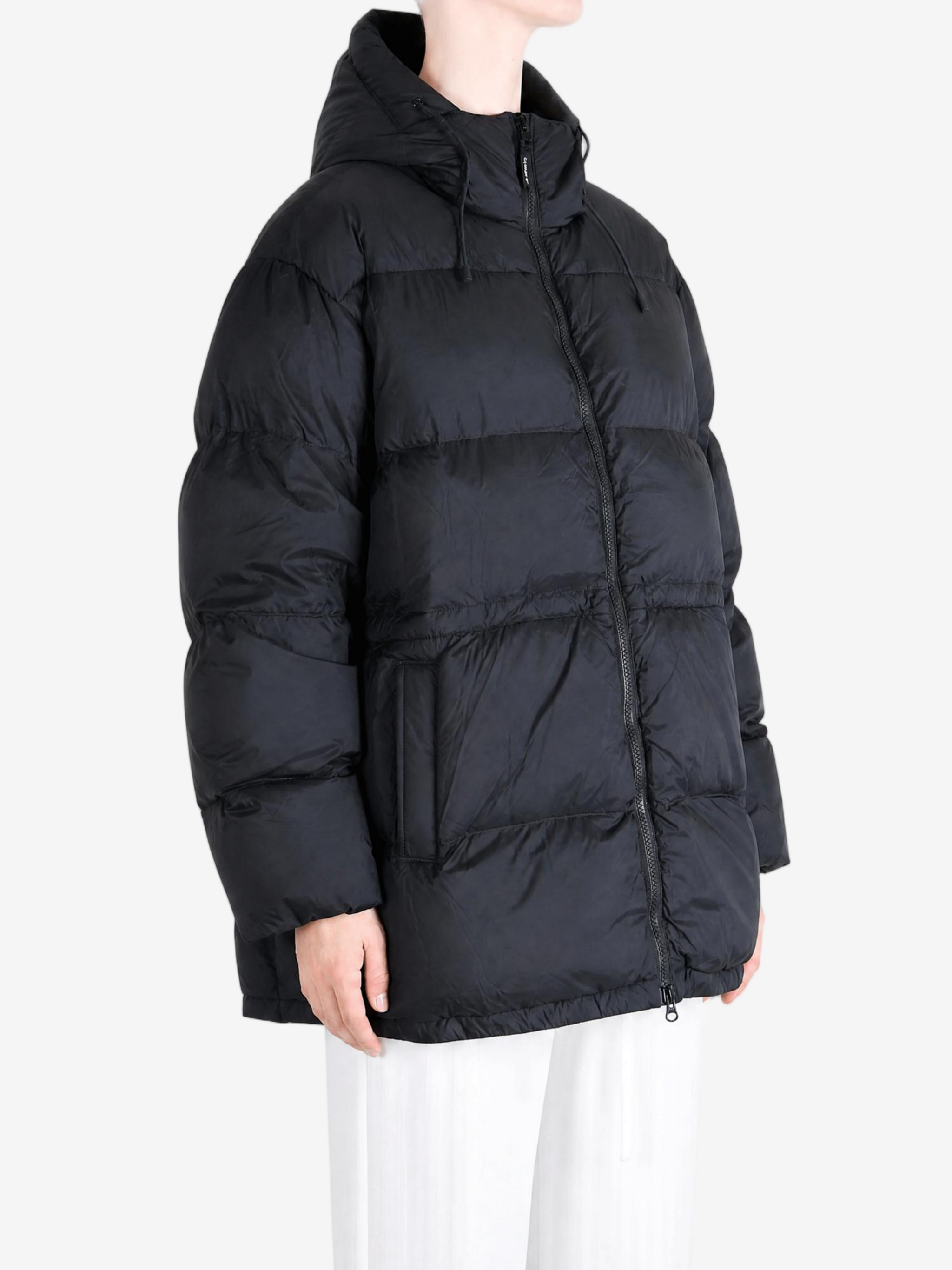 Black jacket worn by a person, showing the jacket fit