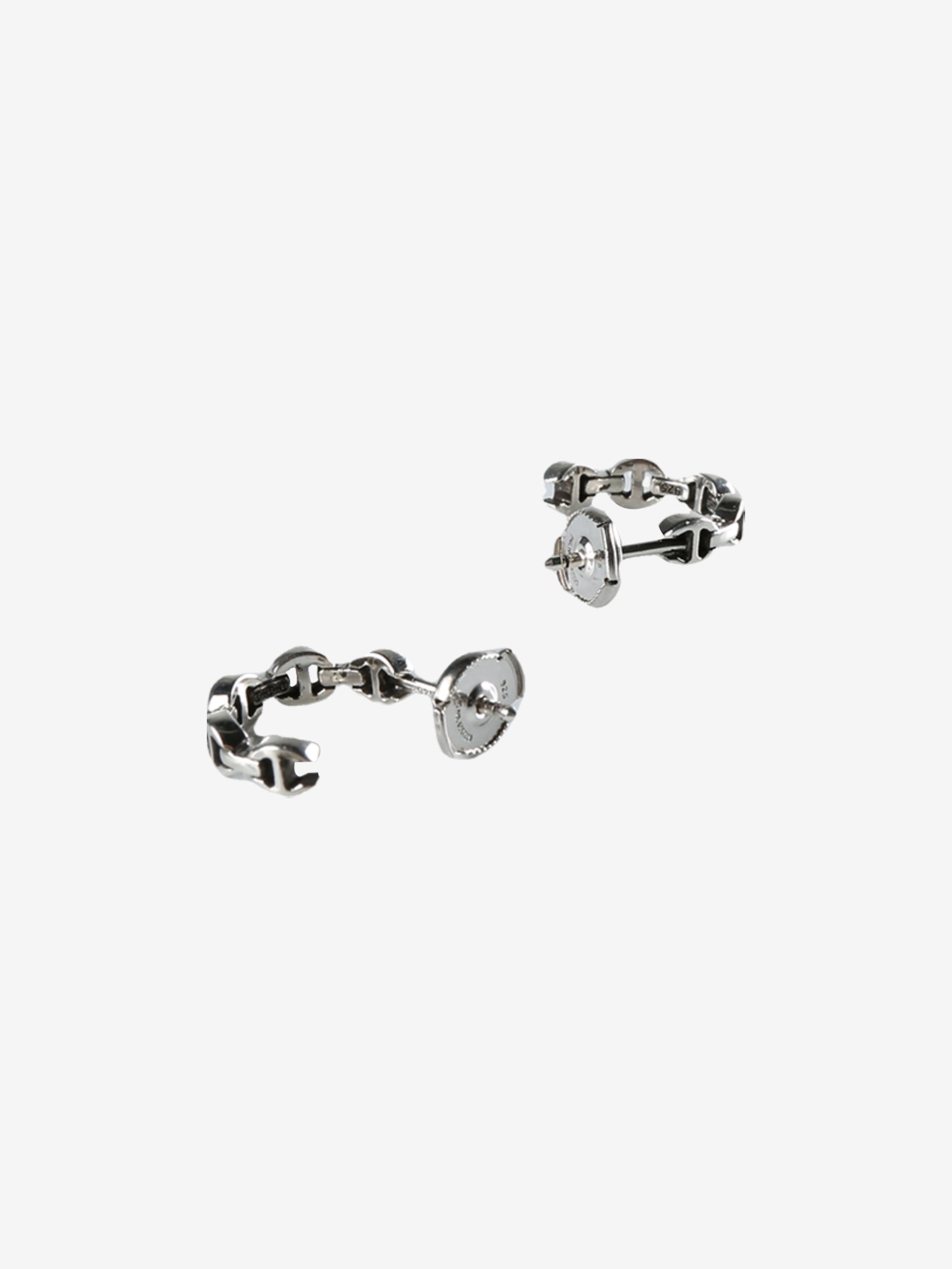 Grey earrings, side view