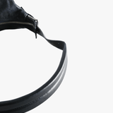 Close up of navy bag, showing texture of the calf leather fabric