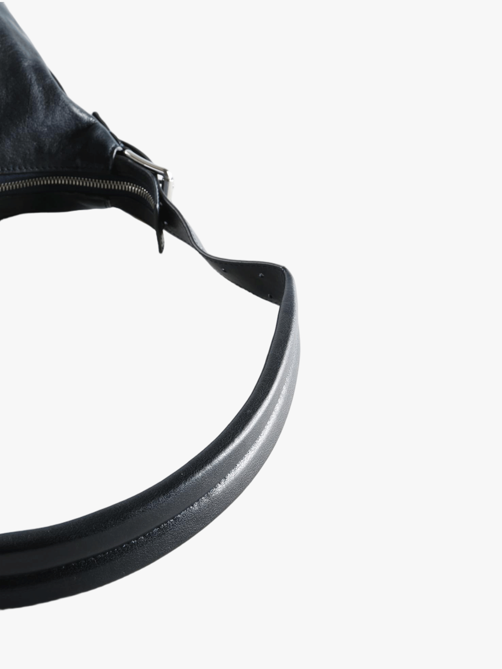 Close up of navy bag, showing texture of the calf leather fabric