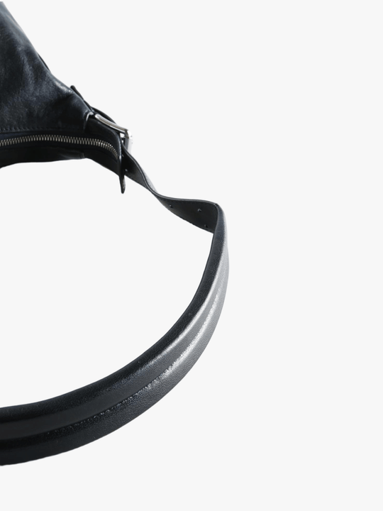 Close up of navy bag, showing texture of the calf leather fabric