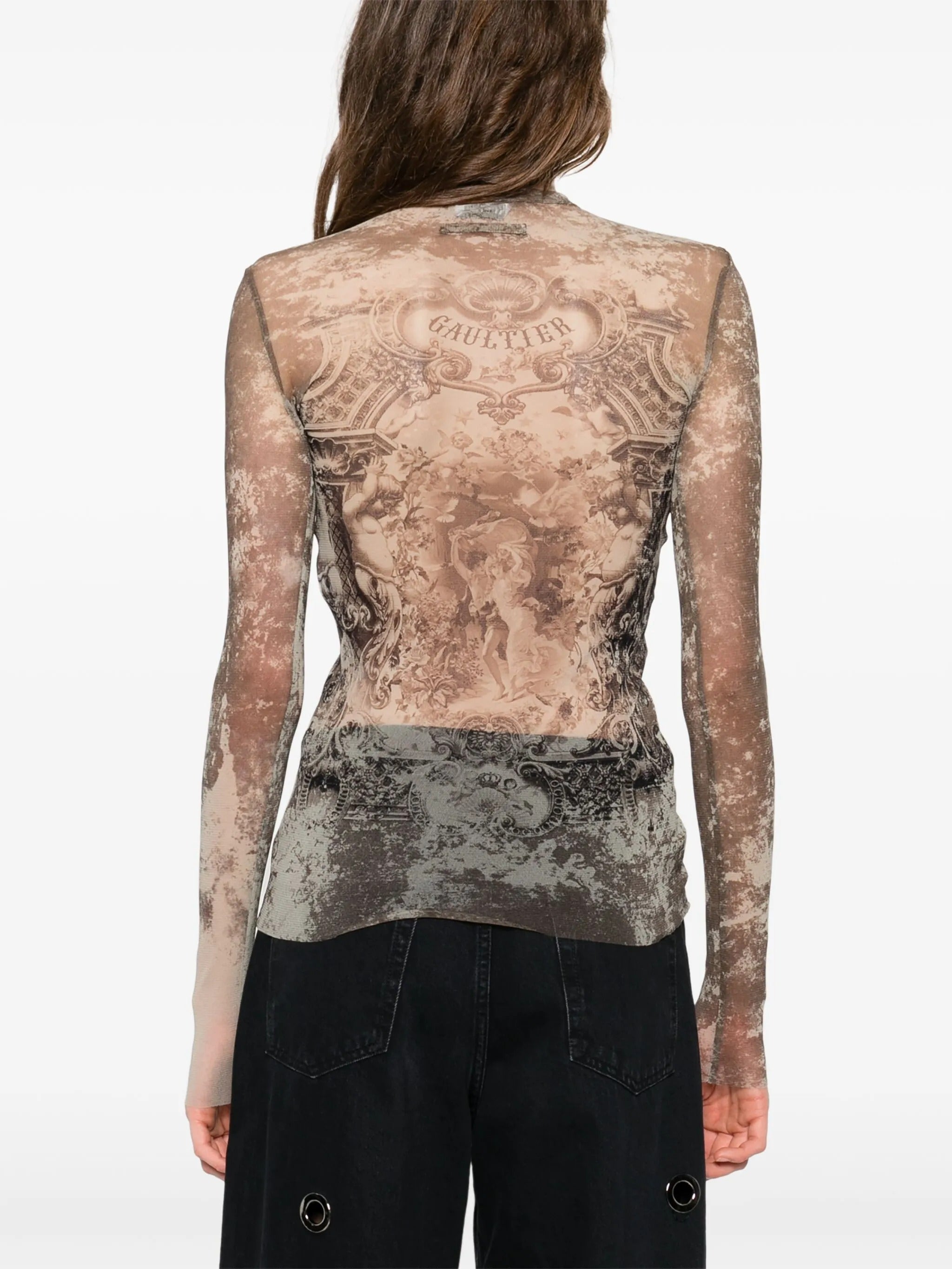 Tan top worn by a person, showing the  top fit