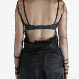 Black top worn by a person, showing the top's fit