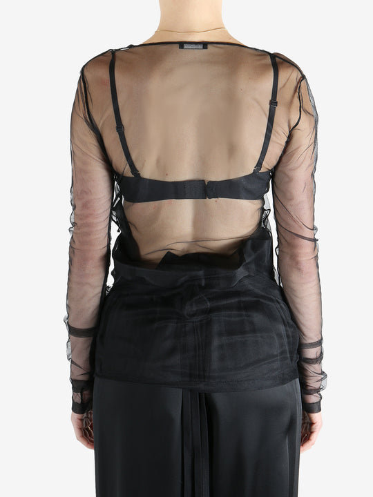 Black top worn by a person, showing the top's fit