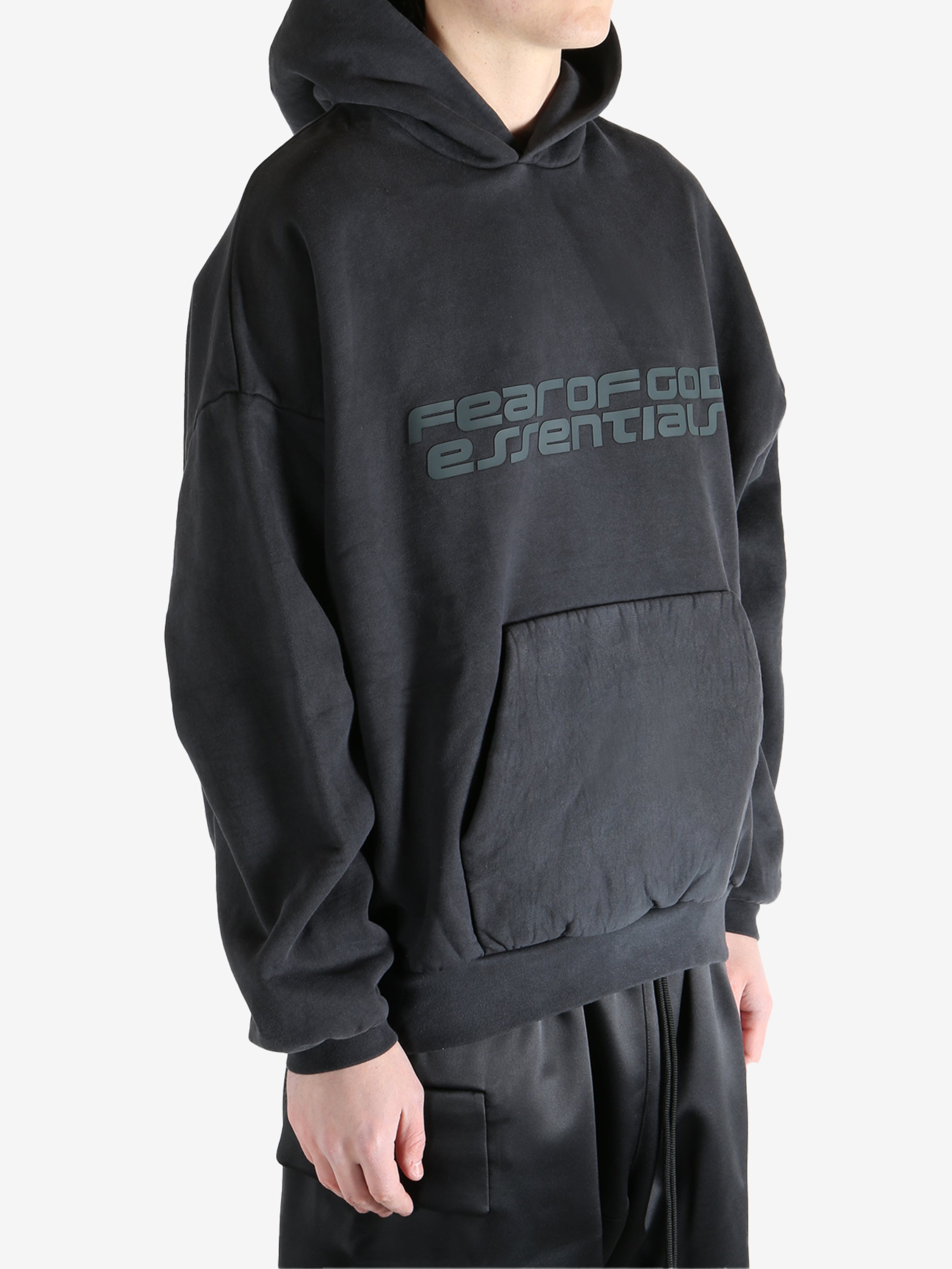 Black hoodie worn by a person, showing the hoodie's fit