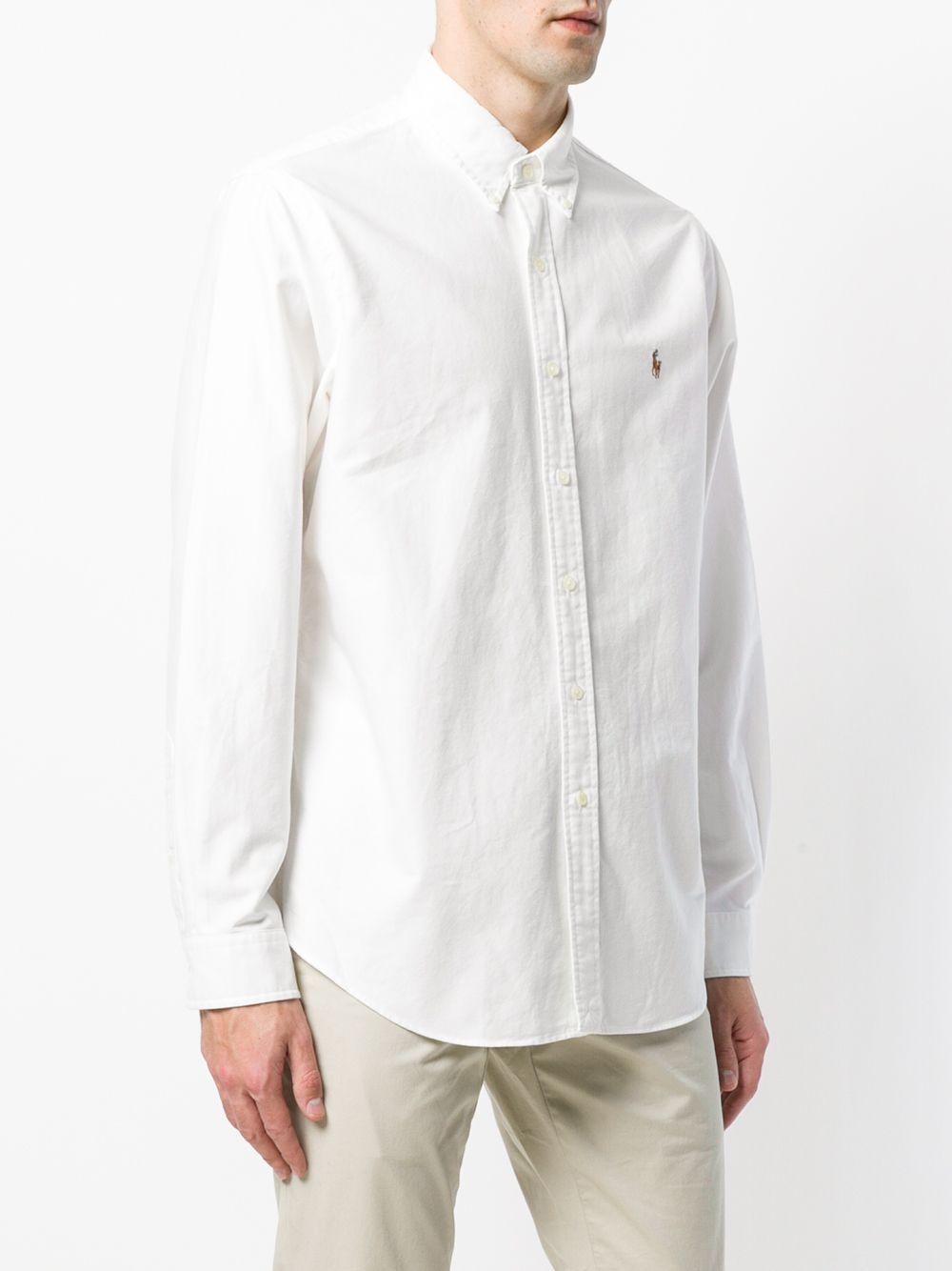 White shirt worn by a person, showing the shirt’s fit