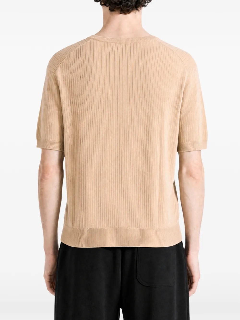 Tan hoodie worn by a person, showing the hoodie fit