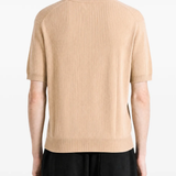 Tan hoodie worn by a person, showing the hoodie fit