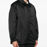 Black jacket worn by a person, showing the jacket fit