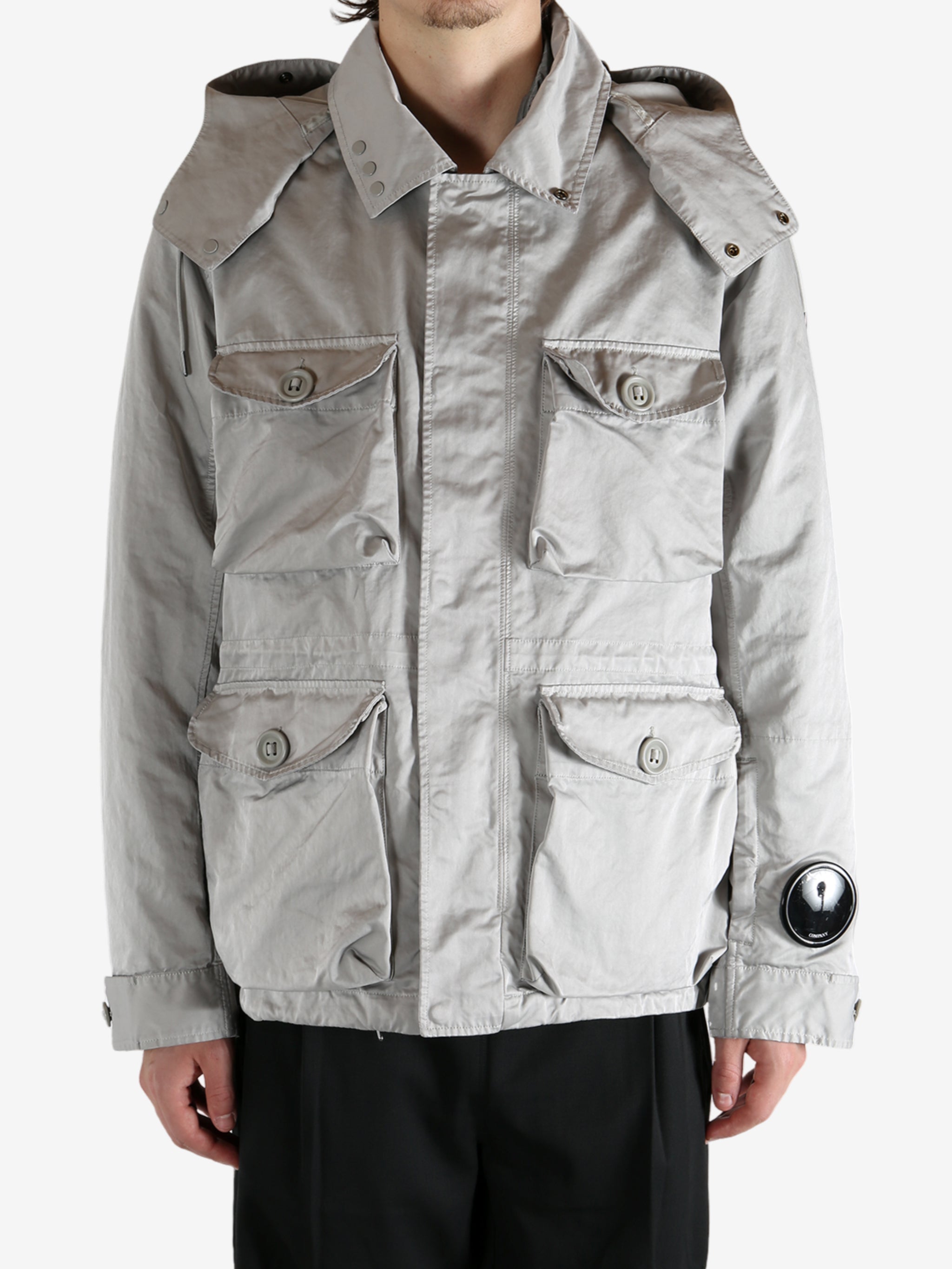 Grey jacket worn by a person, showing the jacket's fit