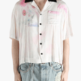 White shirt worn by a person, showing the shirt's fit