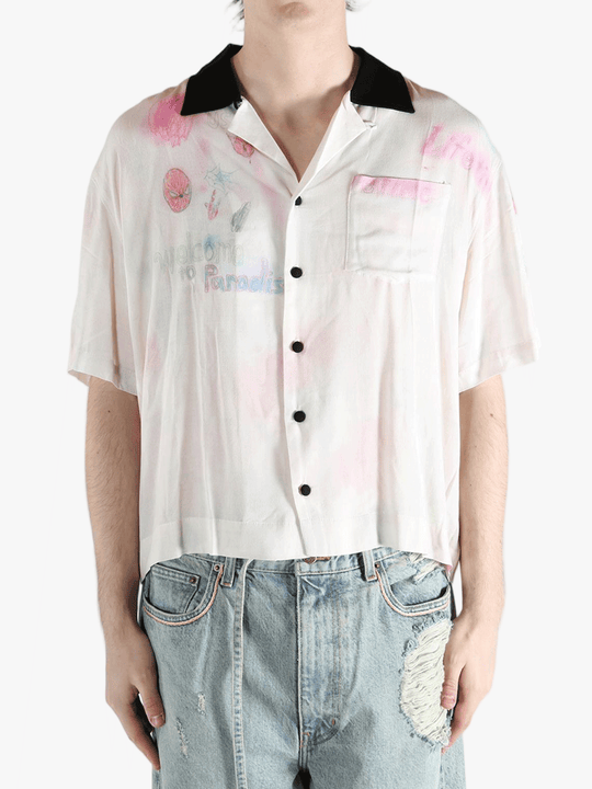 White shirt worn by a person, showing the shirt's fit