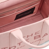 Close up of the pink bag, showing texture of the cotton fabric