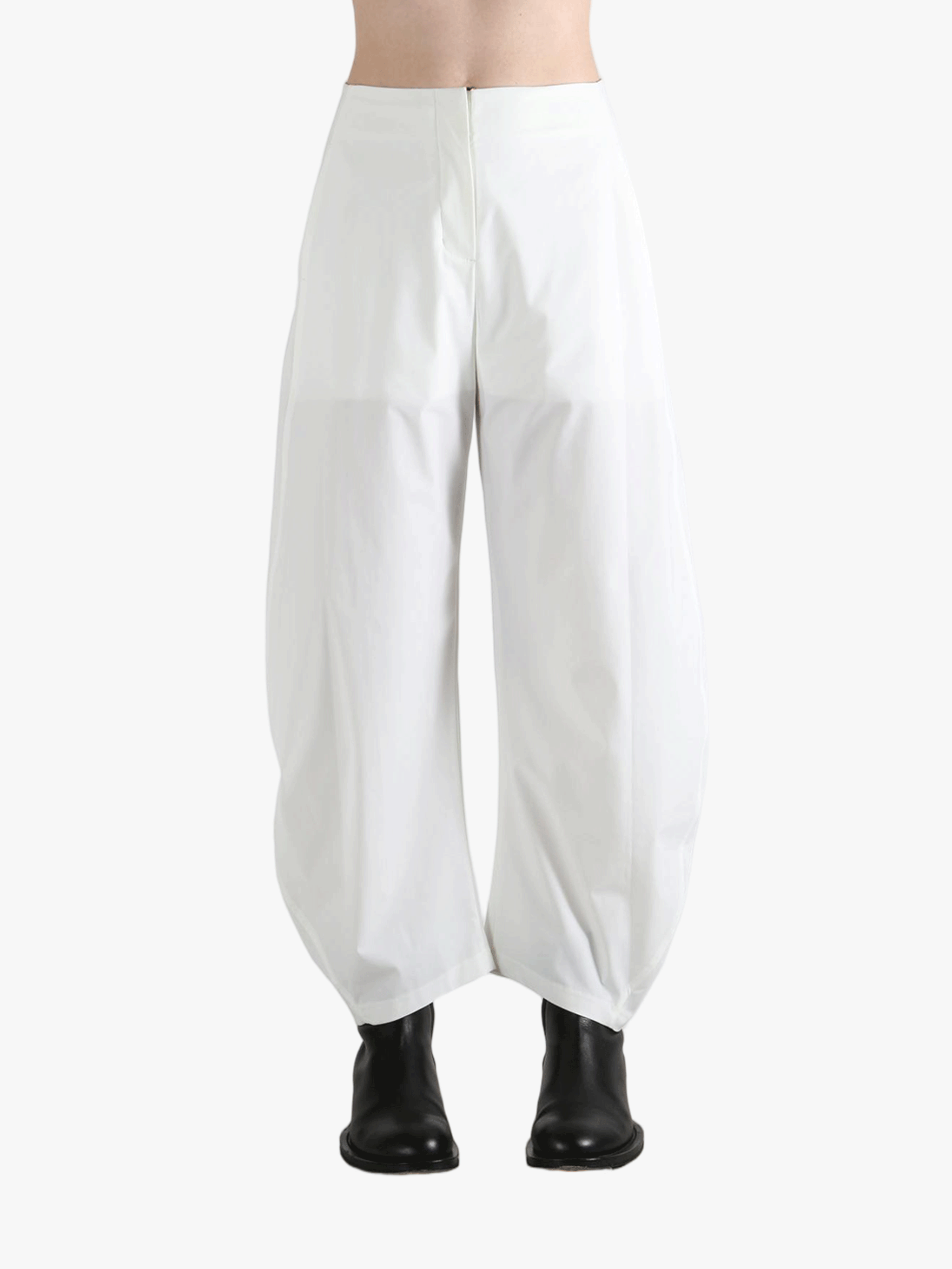 White pants worn by a person, showing the pants fit