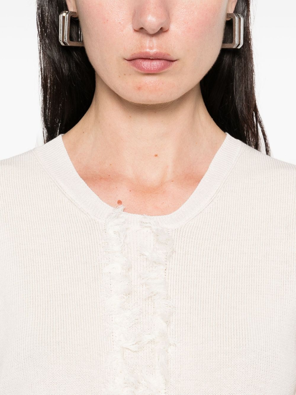 Unknown top worn by a person, showing the top fit