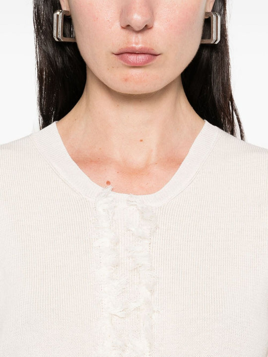 Unknown top worn by a person, showing the top fit