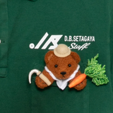 Close up of green shirt, showing texture of the surface cotton fabric