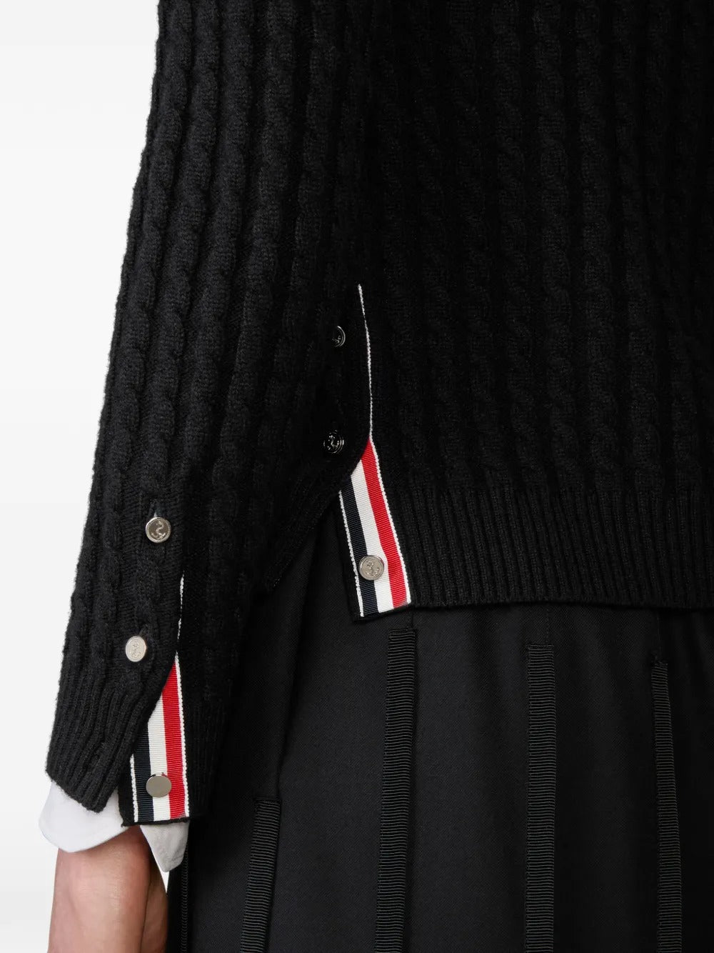 Close up of black cardigan, showing texture of the cashmere fabric