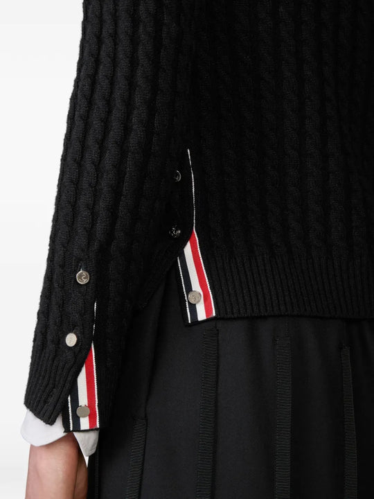 Close up of black cardigan, showing texture of the cashmere fabric