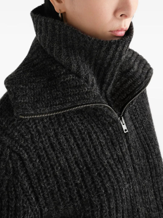 Black scarf worn by a person, showing the scarf fit