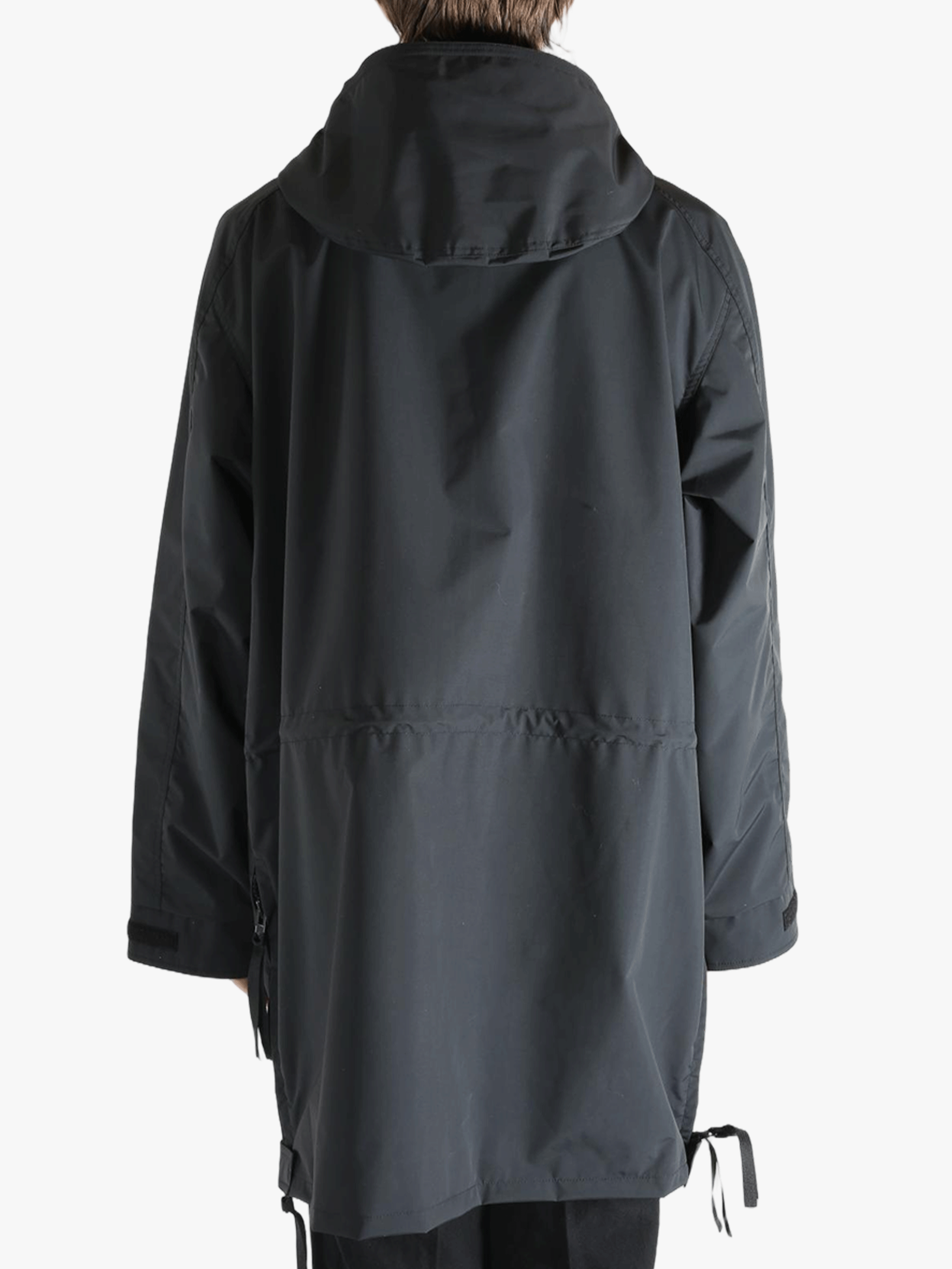 Black jacket worn by a person, showing the jacket's fit
