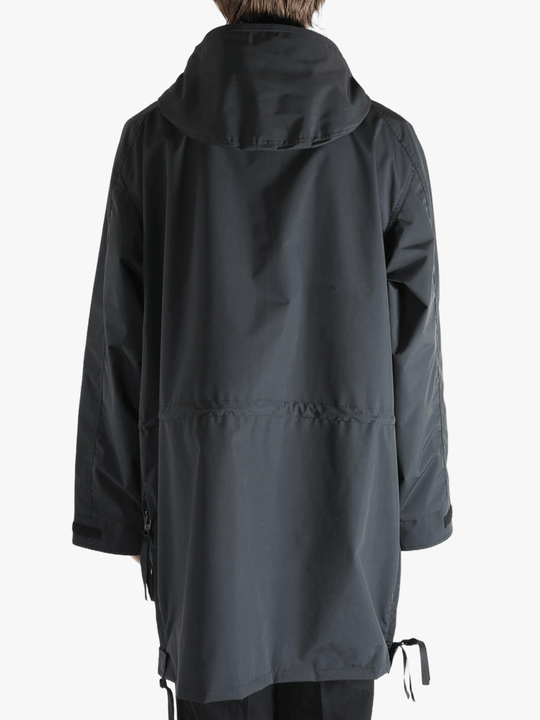 Black jacket worn by a person, showing the jacket's fit