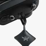 close up of black bags, showing texture of the cow leather fabric