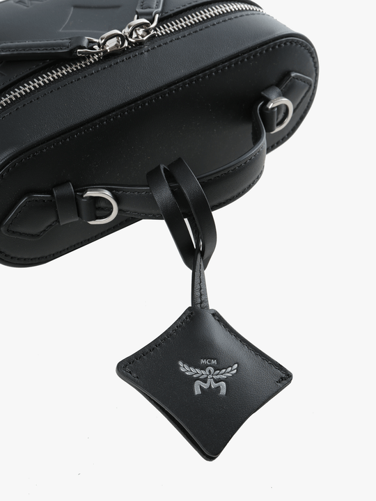 close up of black bags, showing texture of the cow leather fabric
