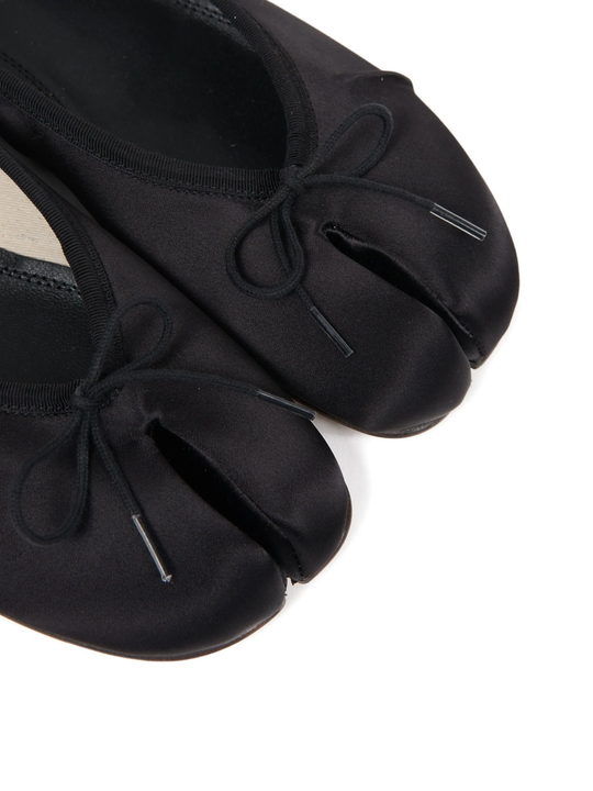 Close up of black flats, showing texture of the Cotton and  Acetate fabric
