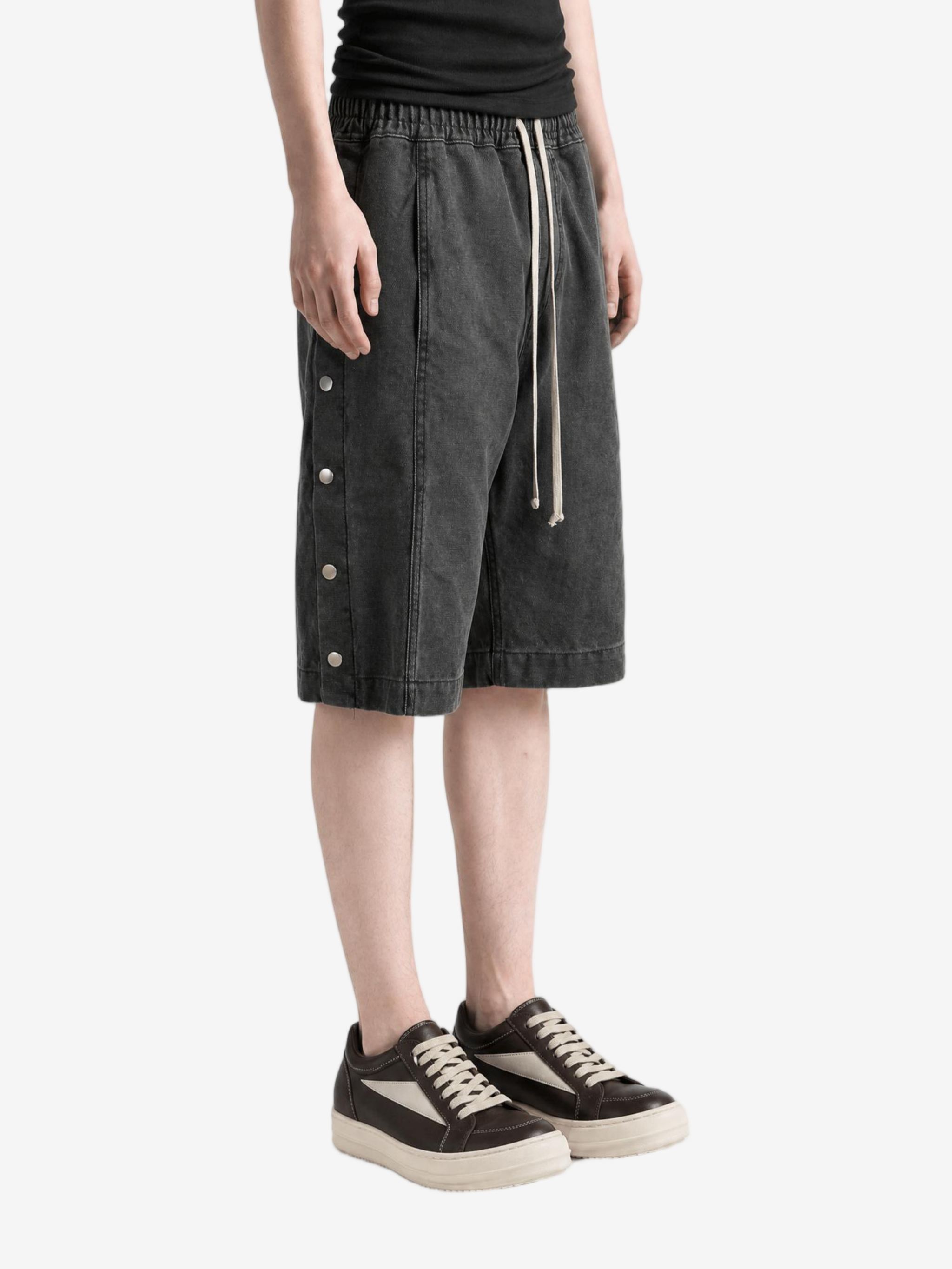 Black shorts worn by a person, showing the shorts fit