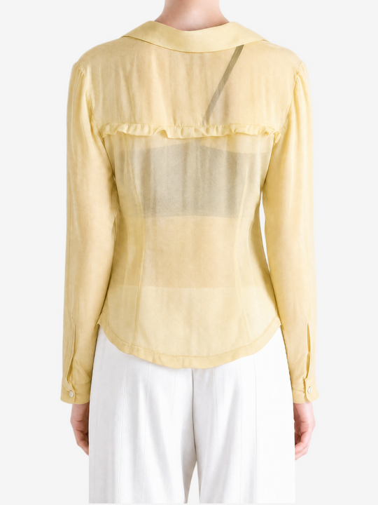 Tan shirt worn by a person, showing the shirt fit