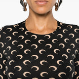 Close up of black tops, showing texture of the recycled polyamide and recycled spandex fabric