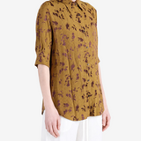 Yellow shirt worn by a person, showing the shirt fit